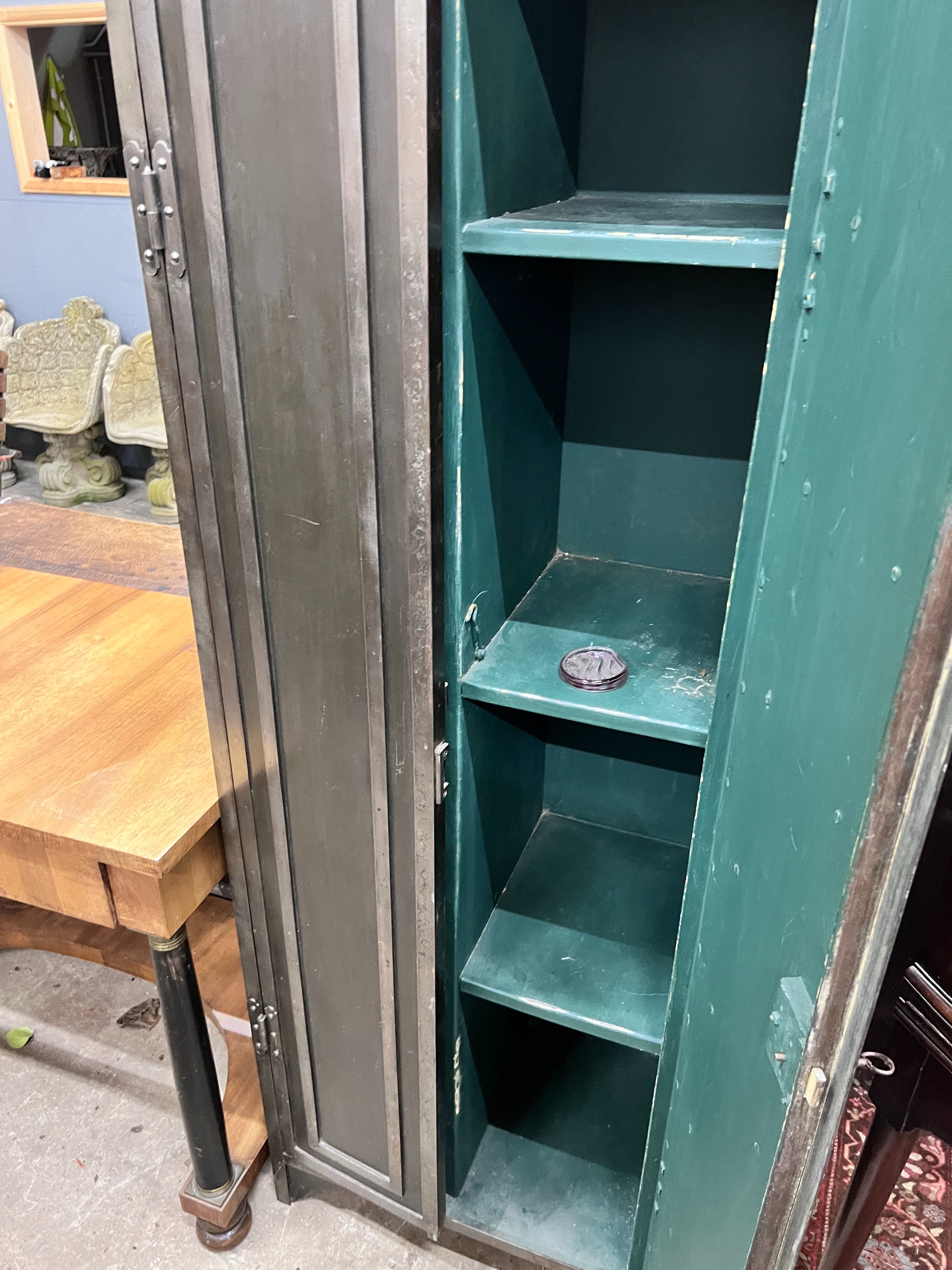 An Indian style metal two door cupboard, width 60cm, depth 41cm, height 186cm *Please note the sale commences at 9am.